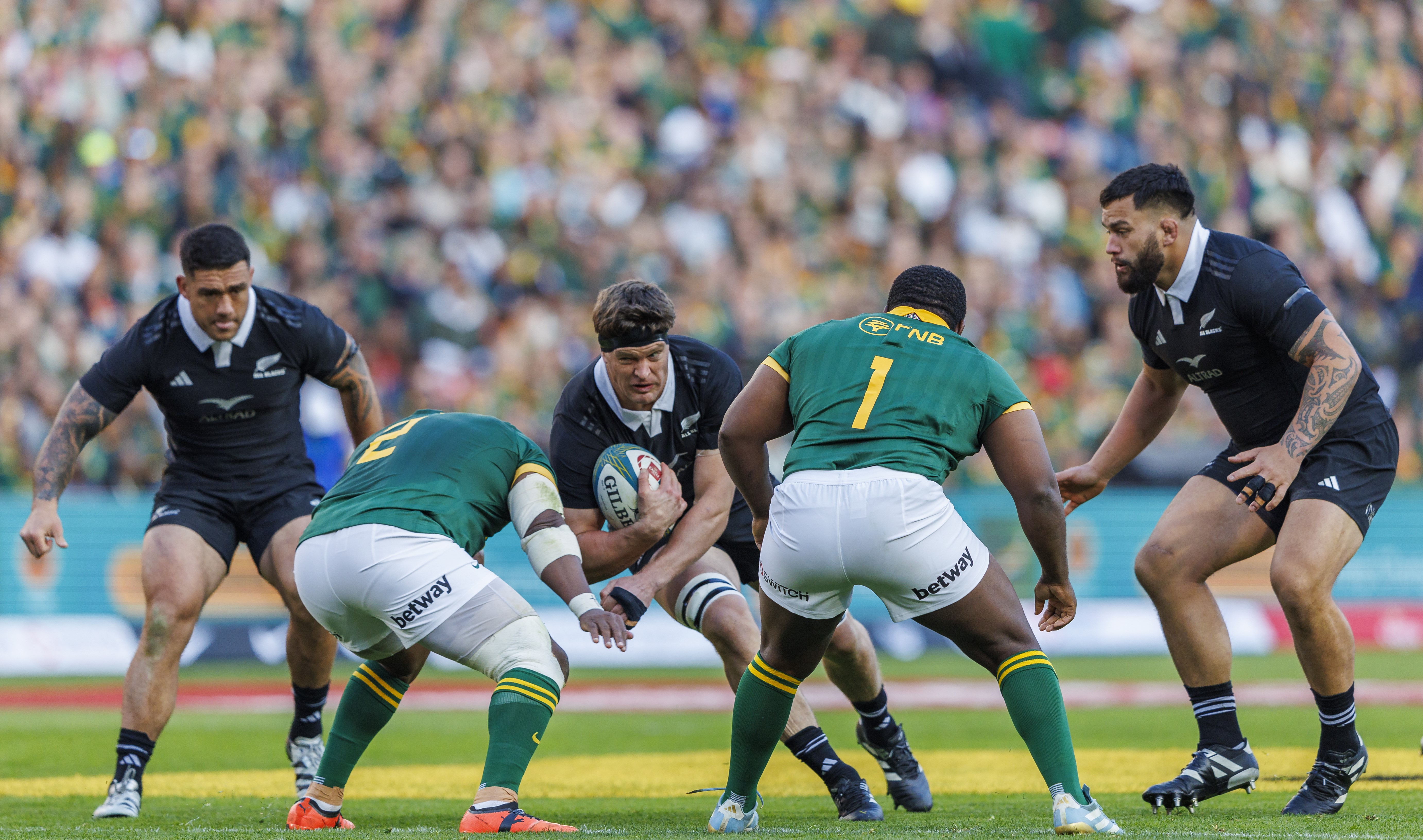 All Blacks captain Scott Barrett carries the ball into the South Africa defence at Ellis Park.