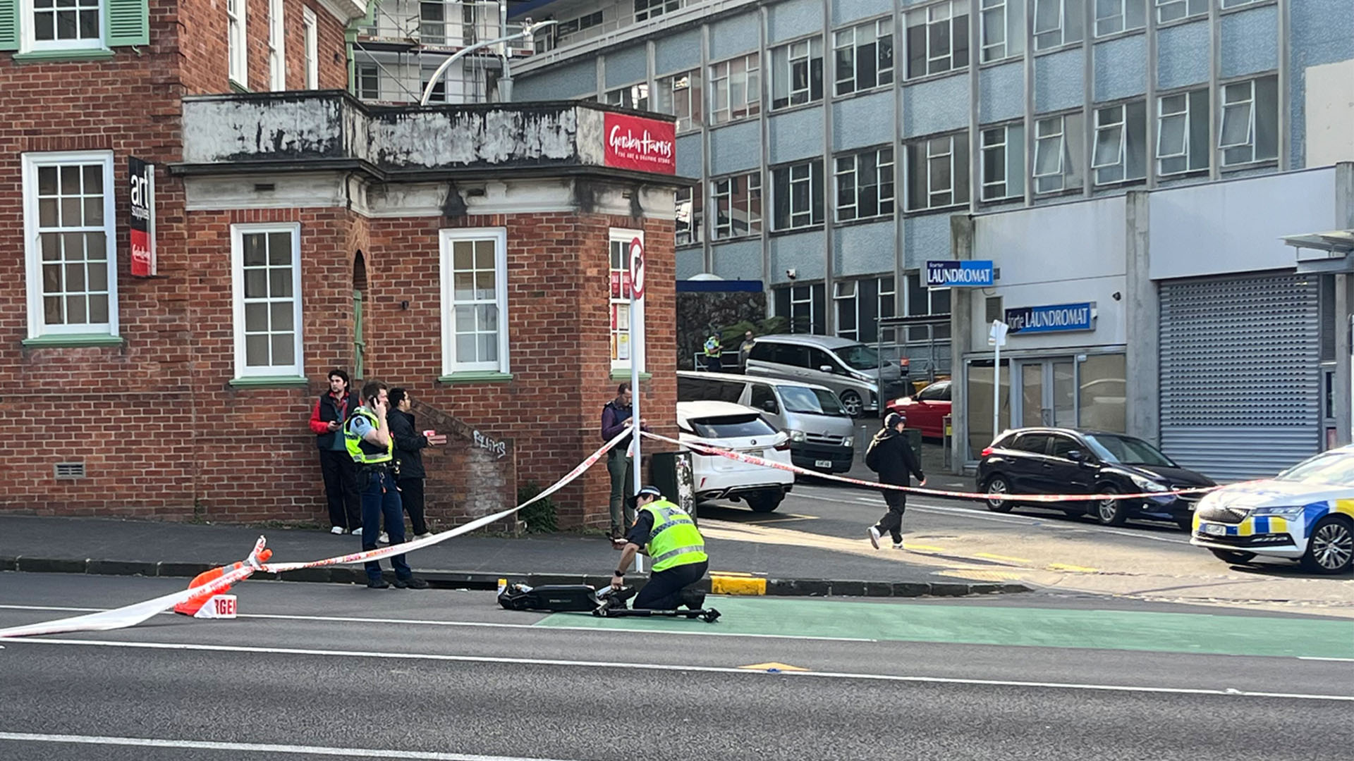 An e-scooter on the road following a collision with a car in central Auckland.