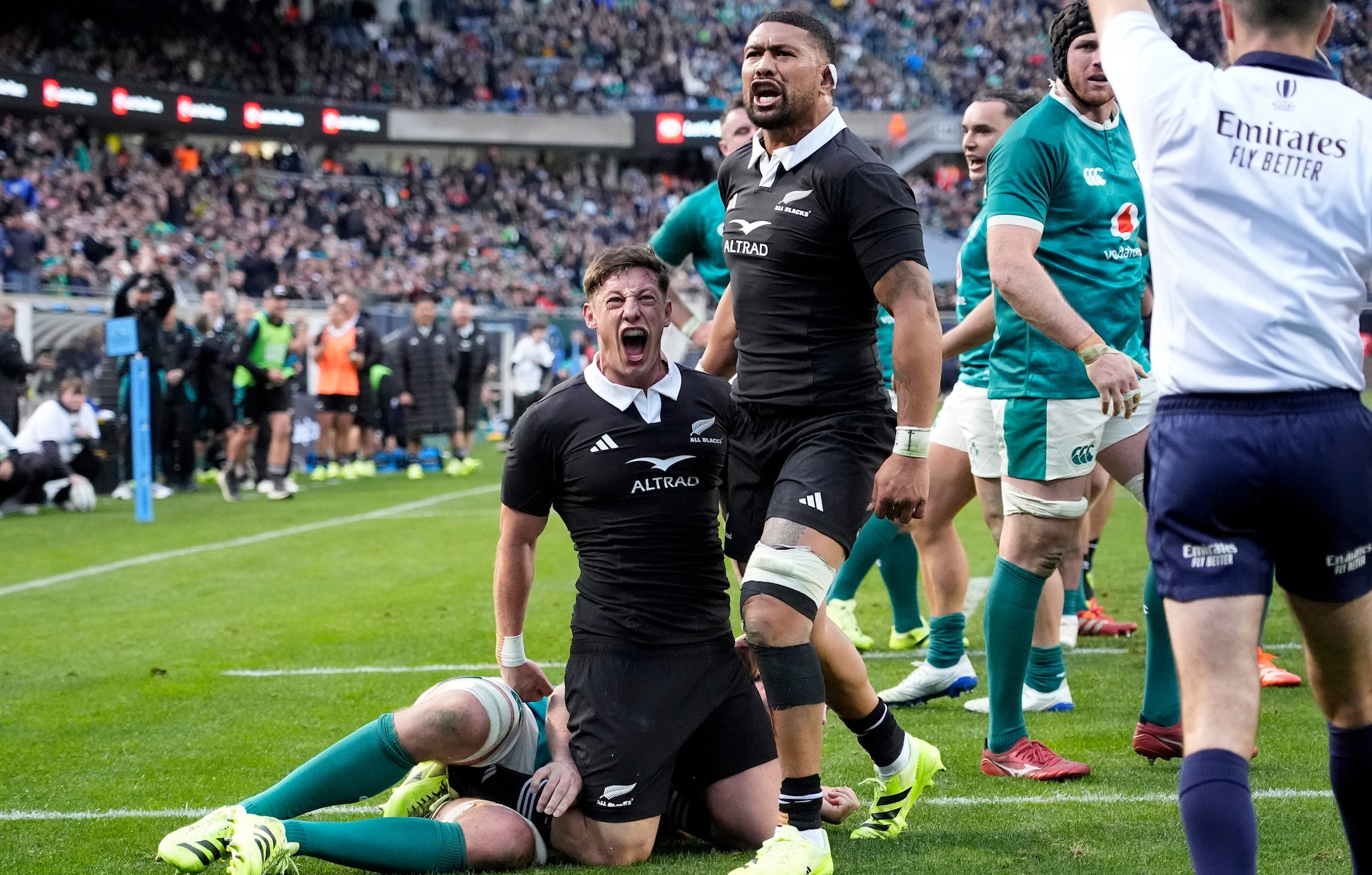 Cam Roigard and Ardie Savea celebrate Roigard's try against Ireland in Chicago.