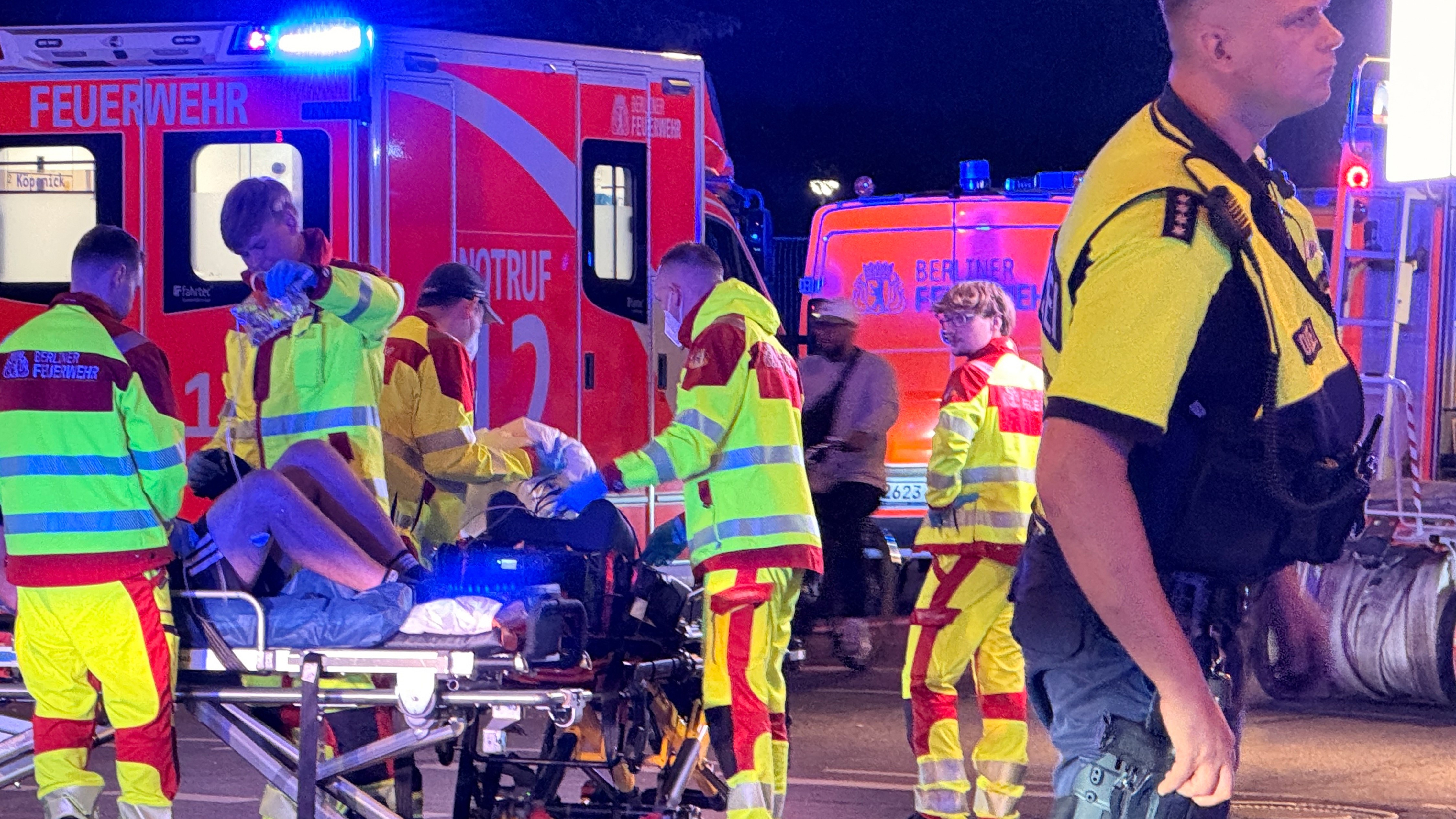 Emergency personnel tend to a person on a stretcher following the cancellation of Christopher Street Day in Berlin on Saturday, July 25, 2026. 
