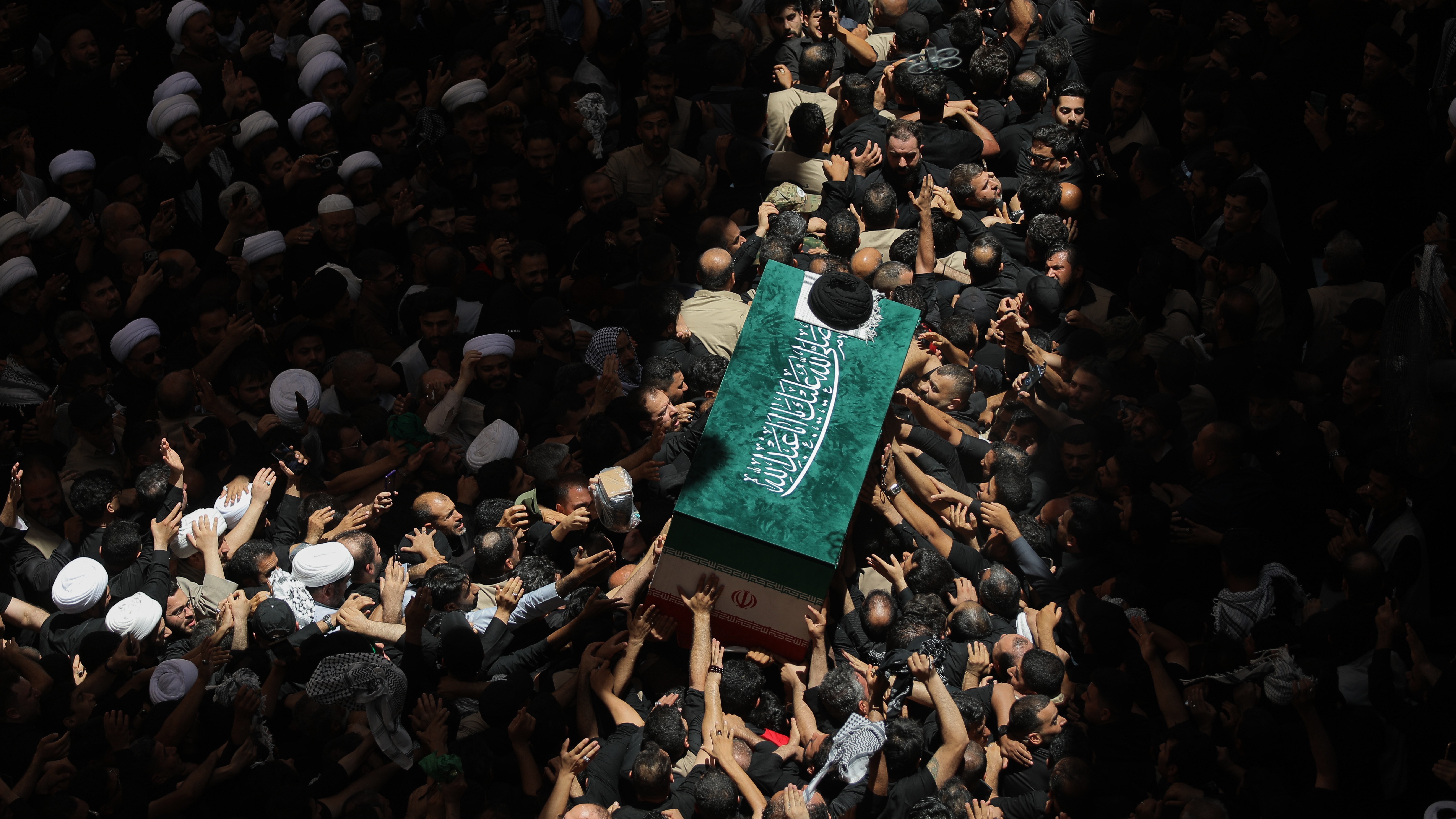 The coffin of the late Iranian Supreme Leader Ayatollah Ali Khamenei is carried by mourners to the Imam Ali Shrine in Najaf, Iraq, Wednesday, July 8, 2026.