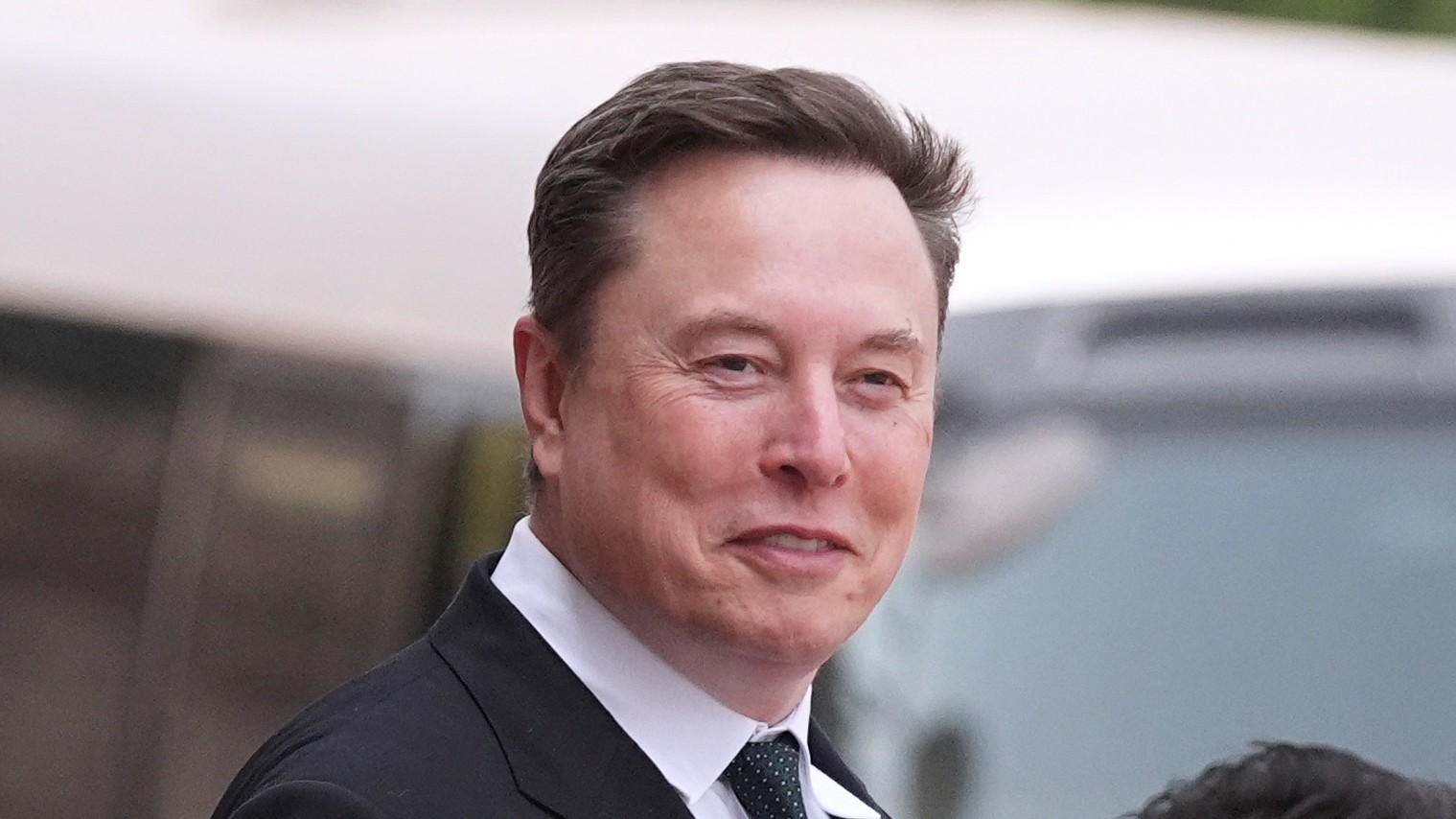 Elon Musk departs after a welcome ceremony with President Donald Trump and China's President Xi Jinping at the Great Hall of the People, Thursday, May 14, 2026, in Beijing.
