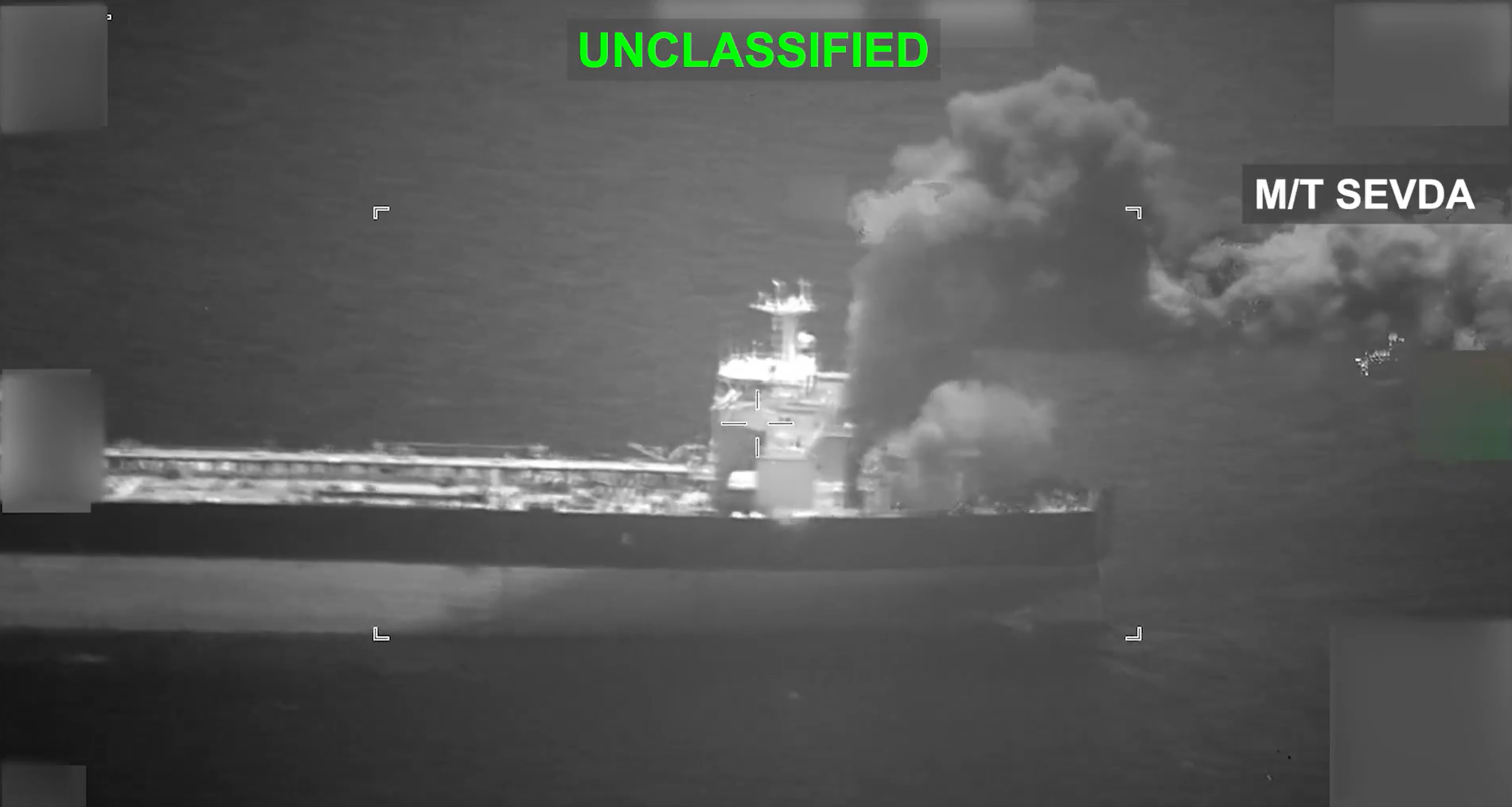 An image shows smoke rising from one of the struck tankers. 