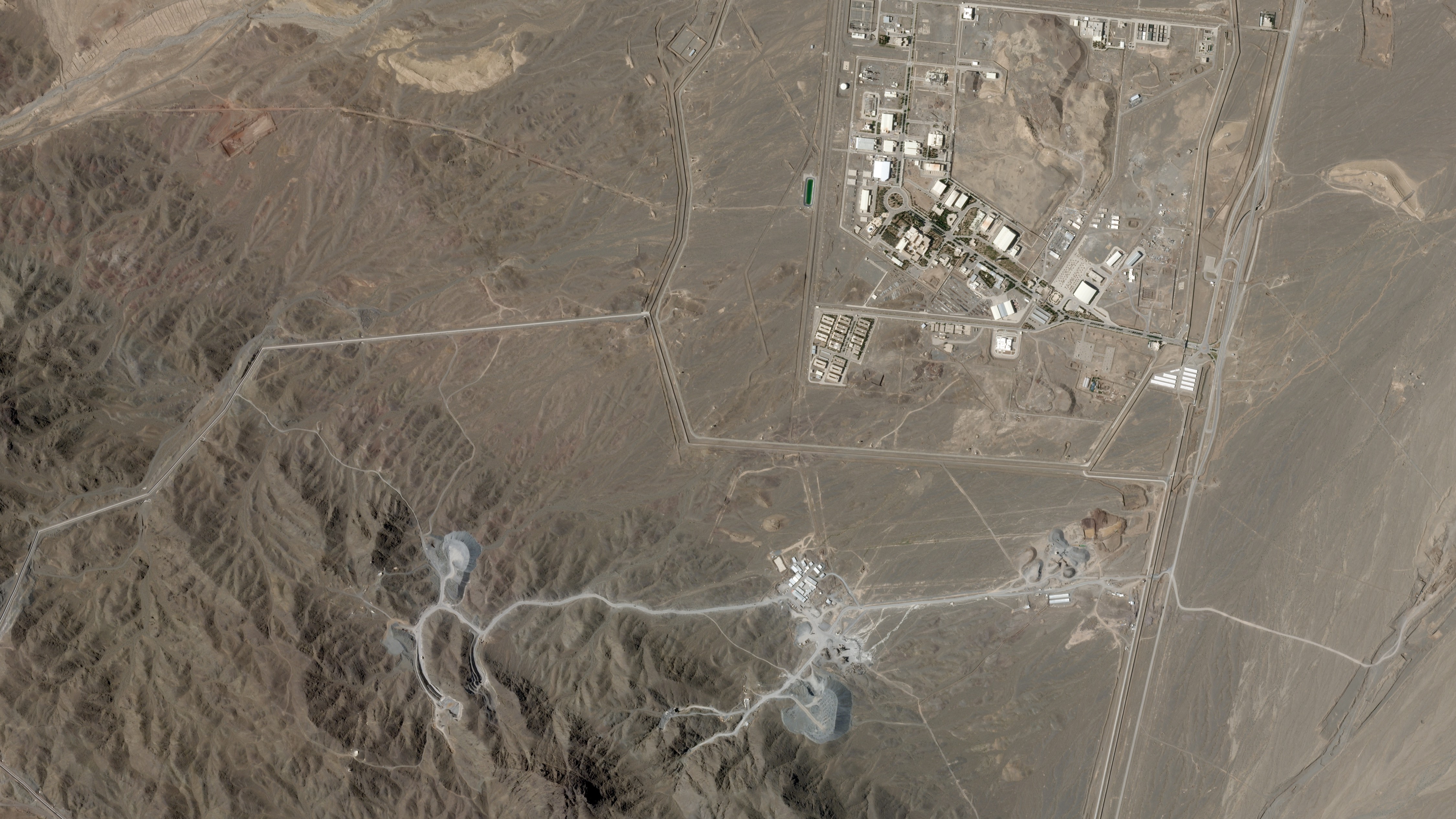 This June 15, 2026, photo from Planet Labs PBC shows Iran's Natanz nuclear enrichment facility, upper right, and the under-construction at Pickaxe Mountain directly to the south.