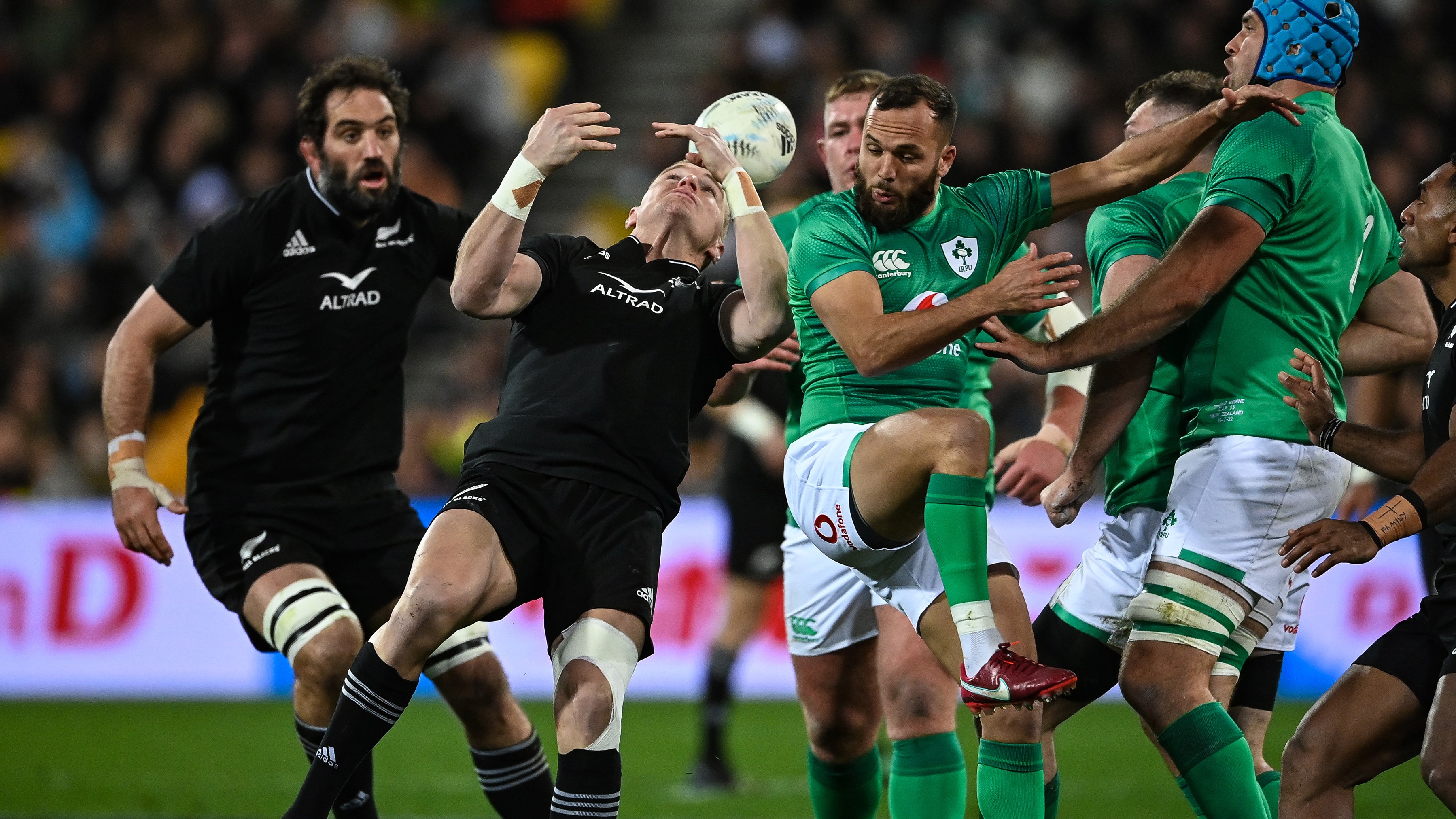 Jordie Barrett and Jamison Gibson-Park contest a high kicking during Ireland's famous victory on Saturday night.