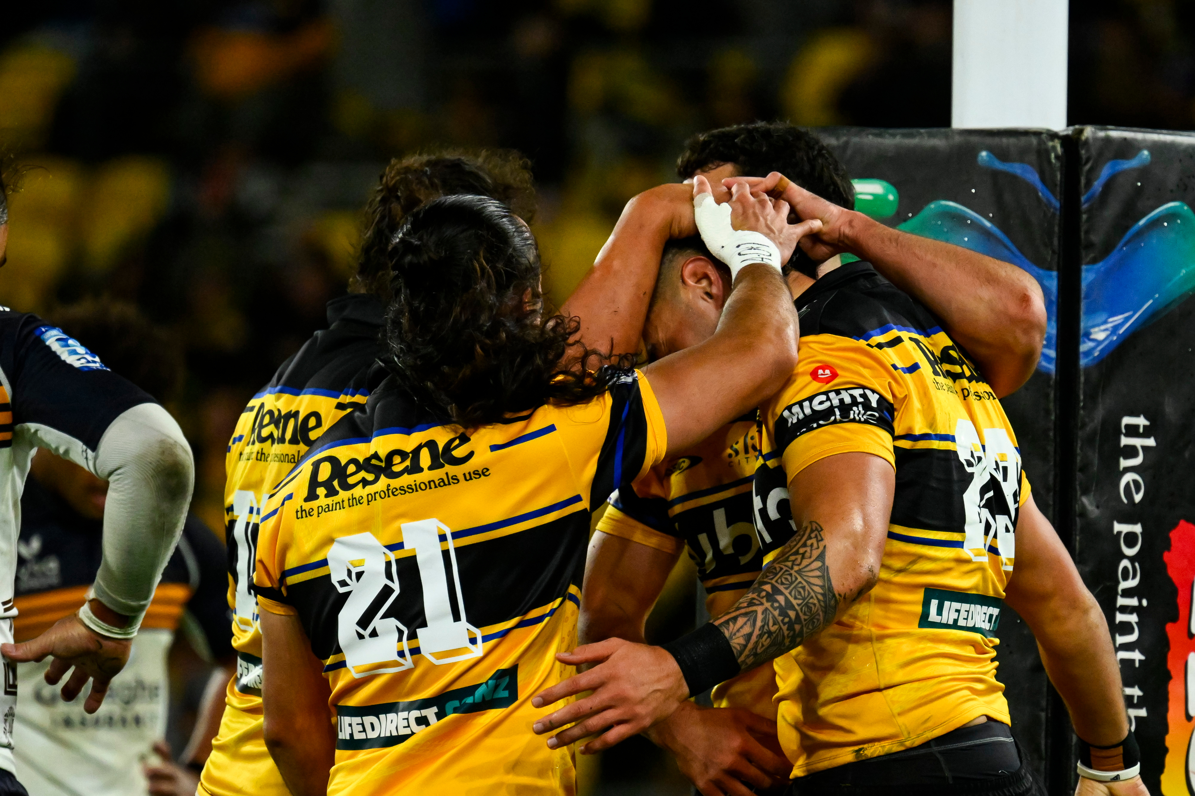 Team celebrates Ngane Punivai of the Hurricanes scoring.
