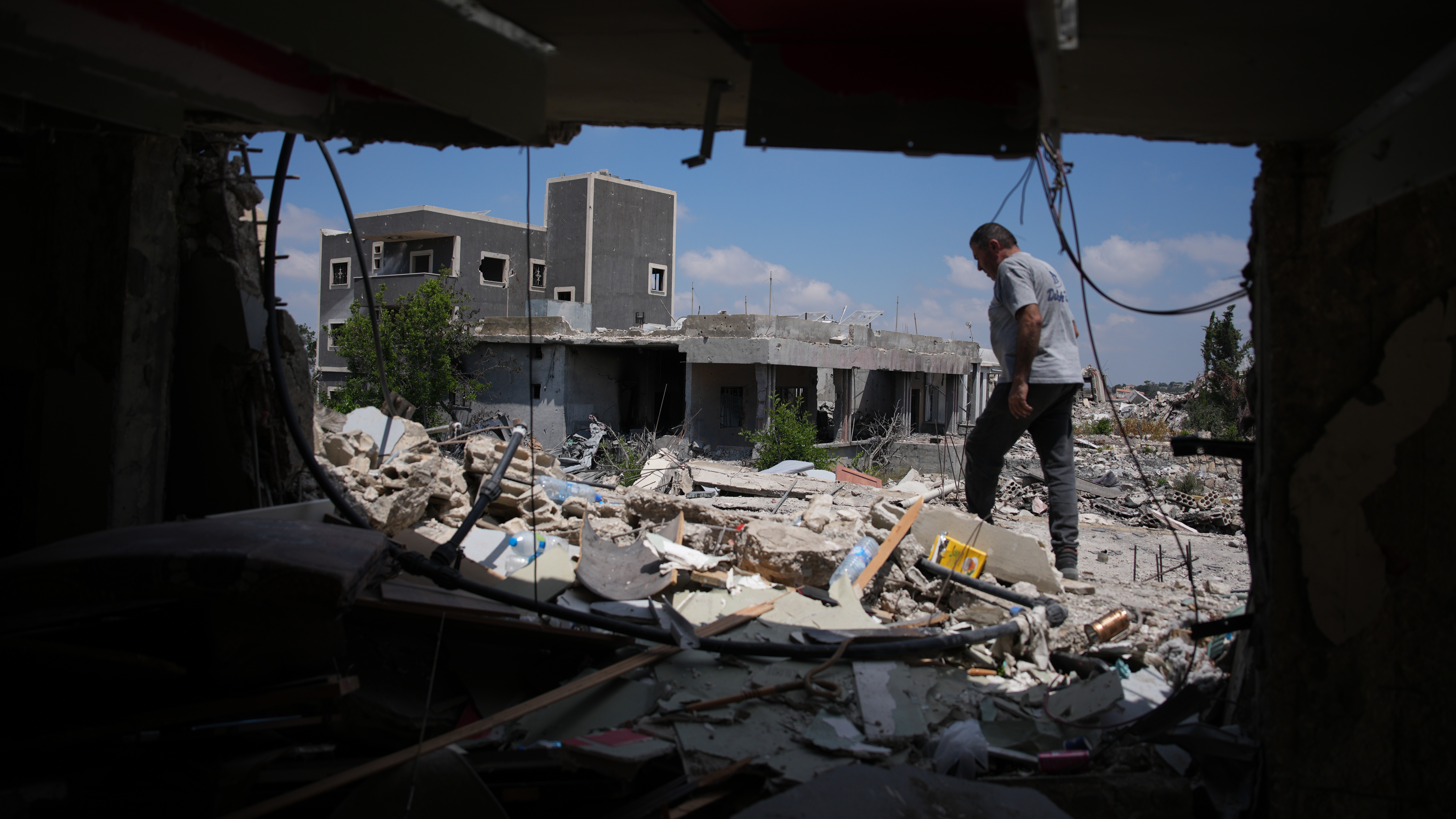 A resident inspects the damage to his home, destroyed in an Israeli airstrike during the Israel-Hezbollah war in Ghandouriyeh village, southern Lebanon.