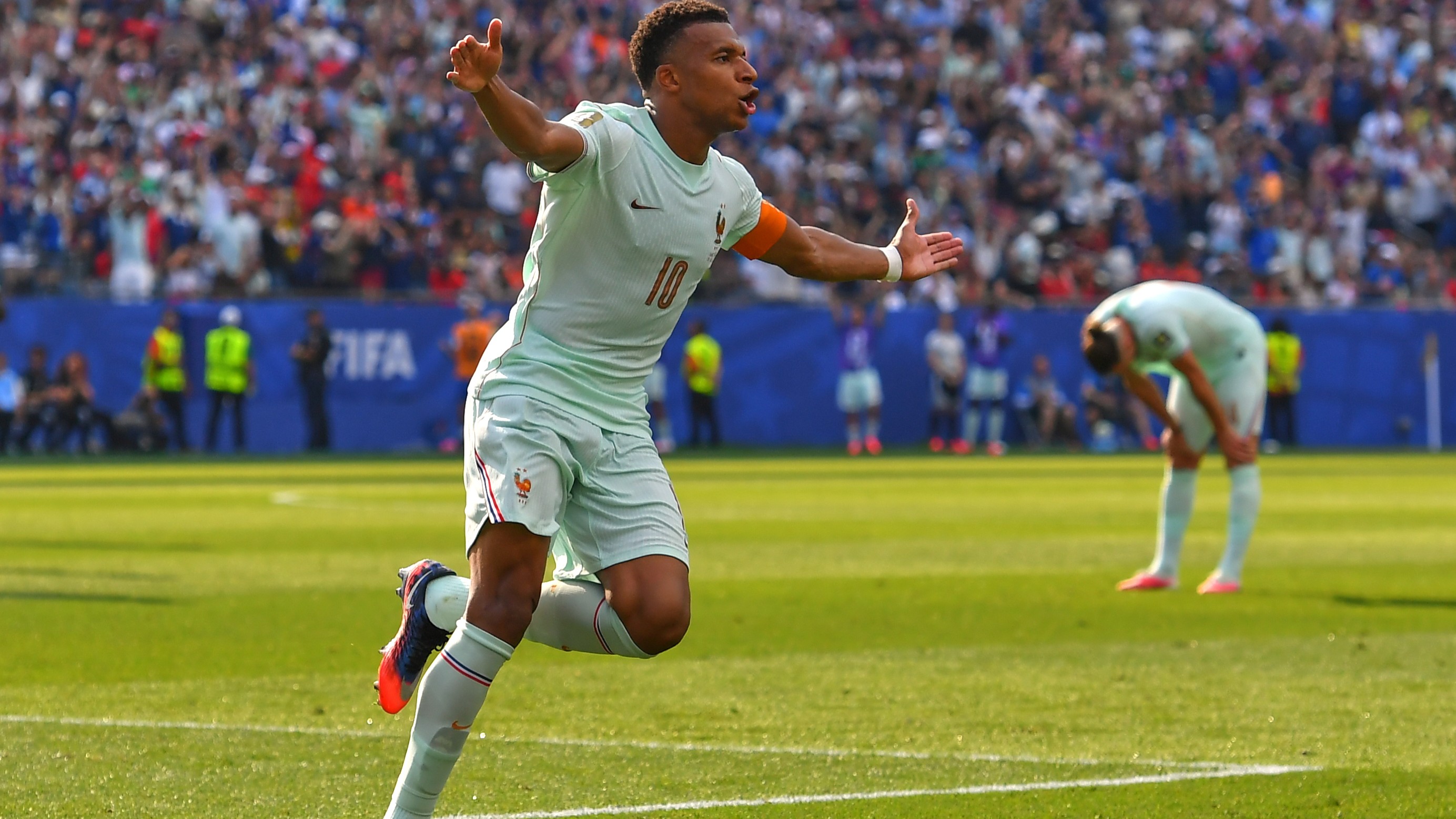 France's Kylian Mbappe (10) celebrates scoring the opening goal during the World Cup quarterfinal soccer match between France and Morocco.
