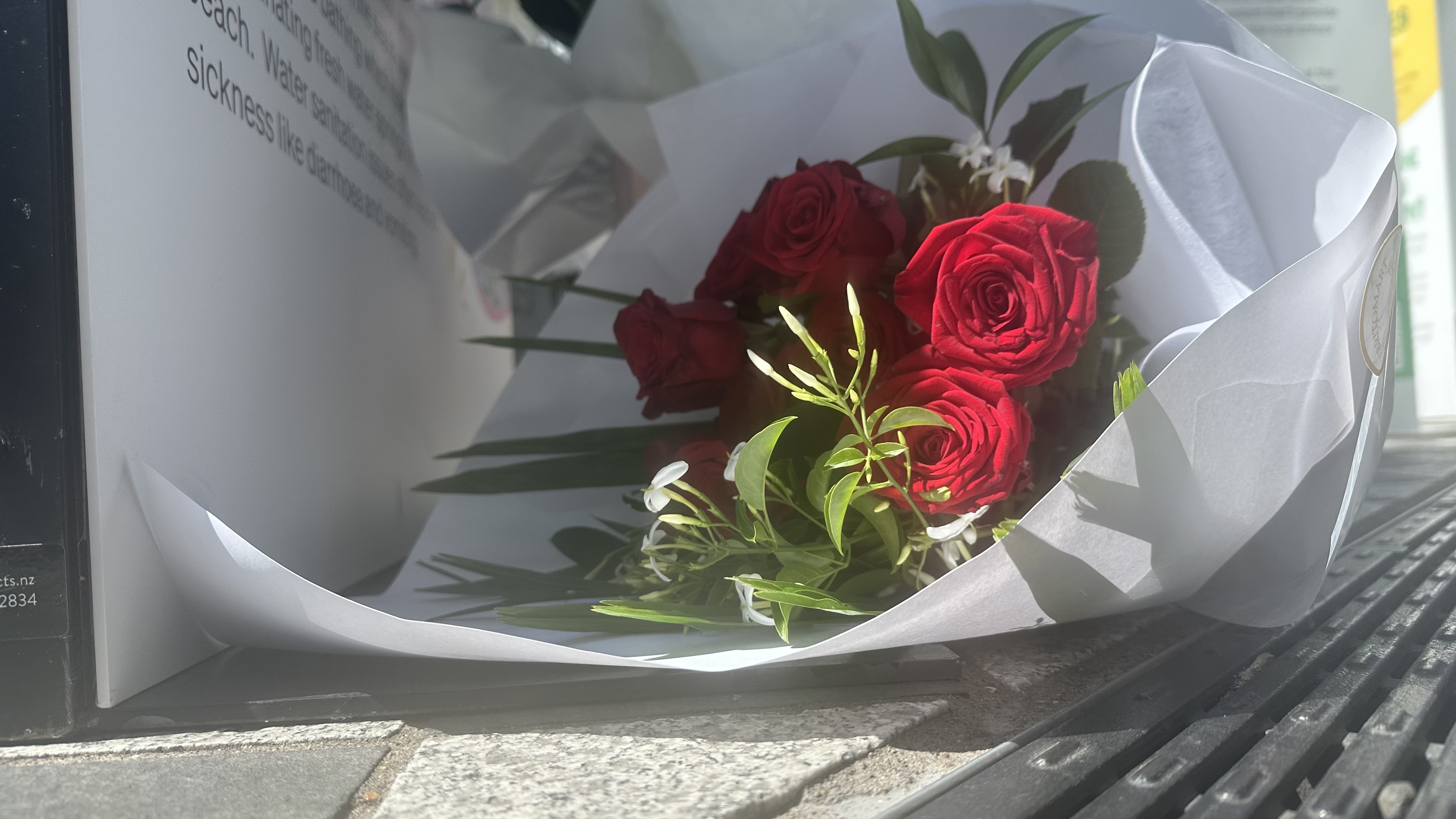 People have started to lay flowers at the scene of the charity event where Efeso Collins died.