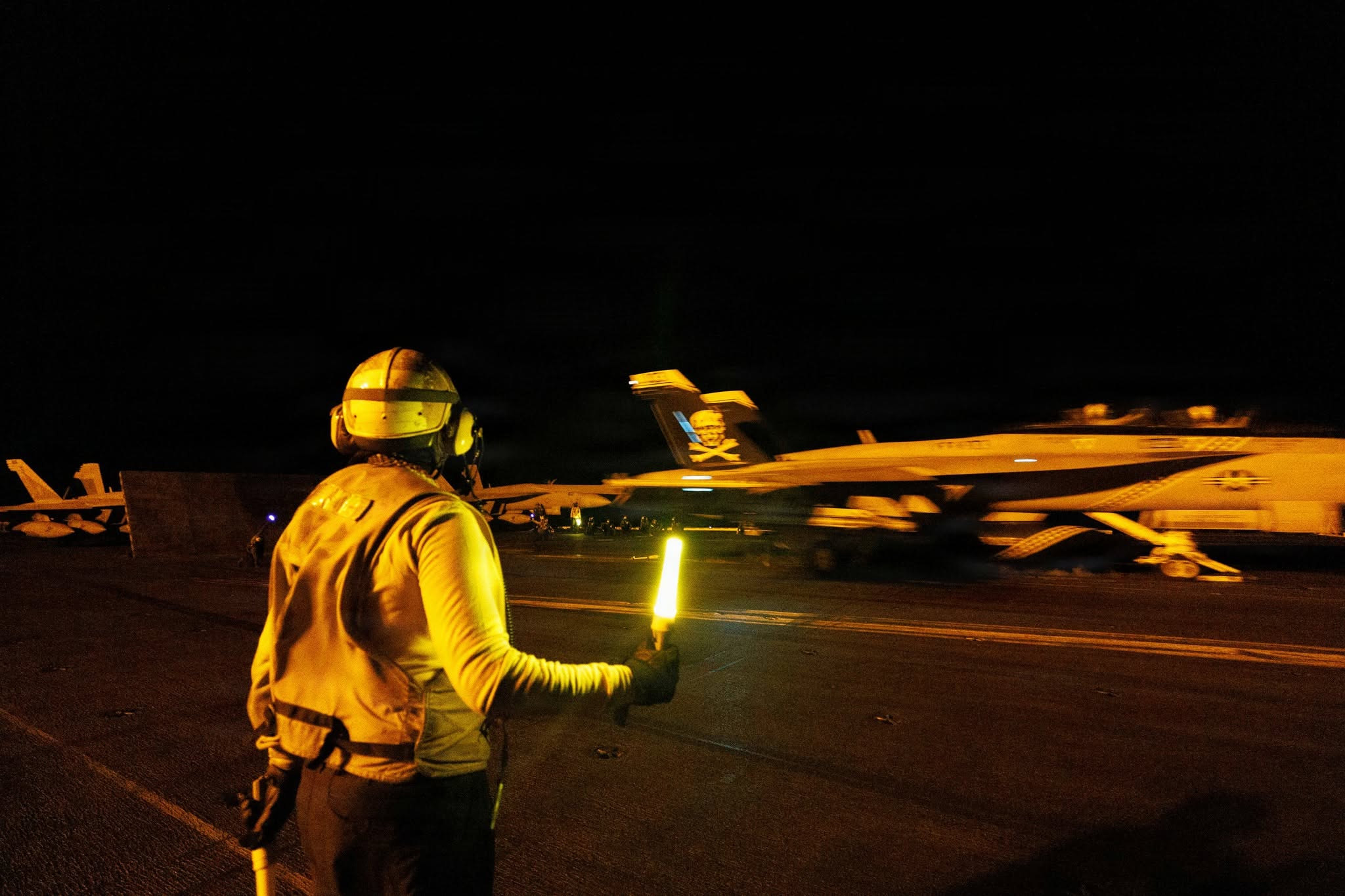 U.S. sailors conduct nighttime flight operations aboard USS George H.W. Bush (CVN 77) while transiting the Arabian Sea.