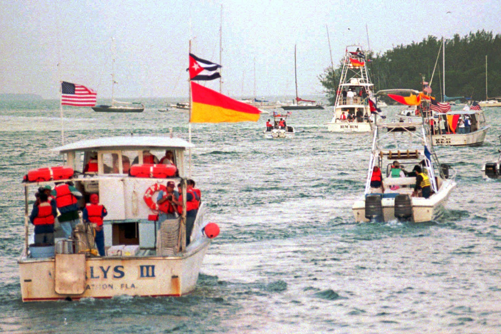 Boats carrying Cuban Americans to the site of the downing of two Brothers to the Rescue planes by Cuban fighters, March 2, 1996.