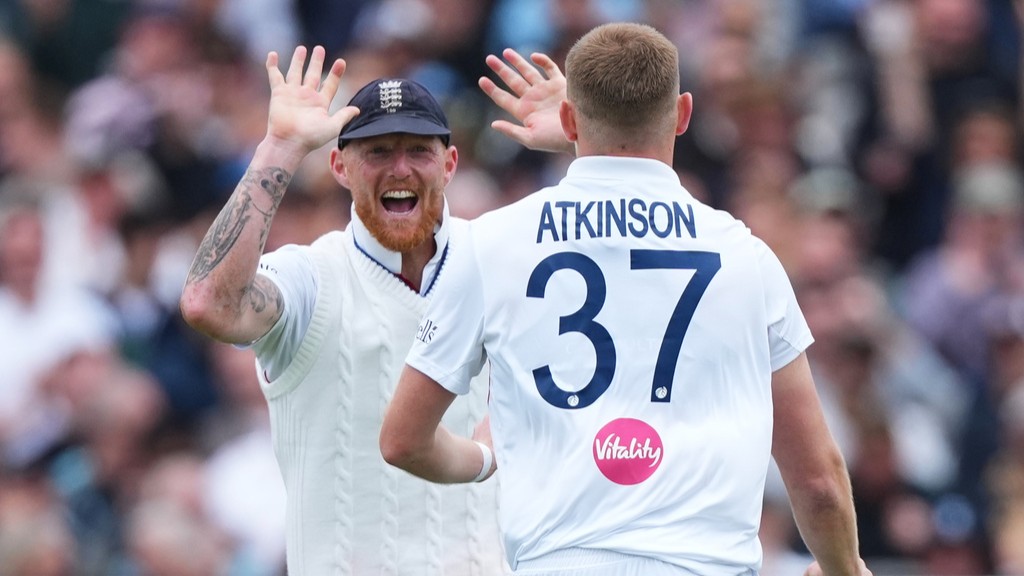 England's Gus Atkinson, right, celebrates with captain Ben Stokes after bowling out New Zealand's Matt Henry.