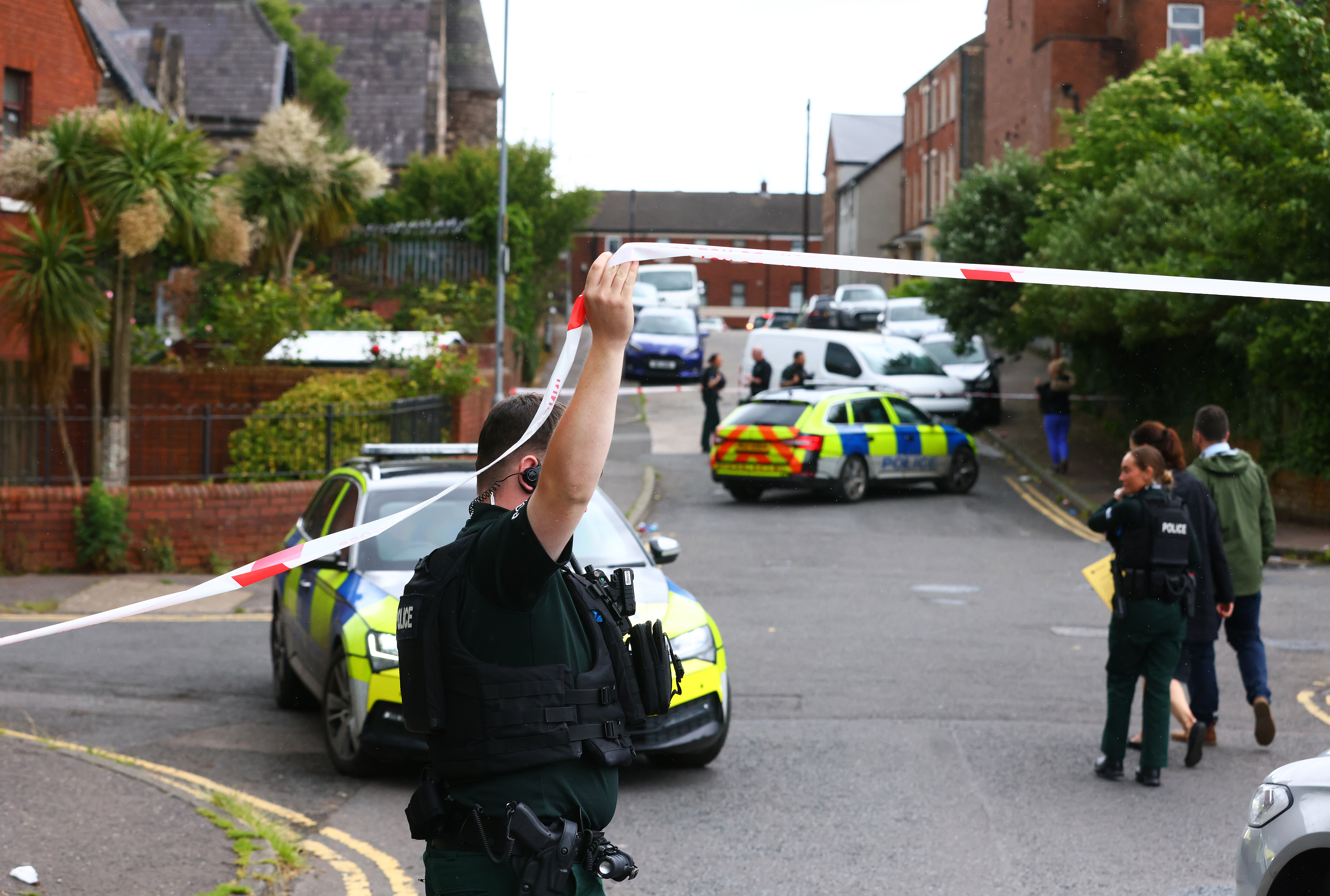 A police cordon at the scene of a stabbing outside apartments in north Belfast, Tuesday, June 3, 2026. 
