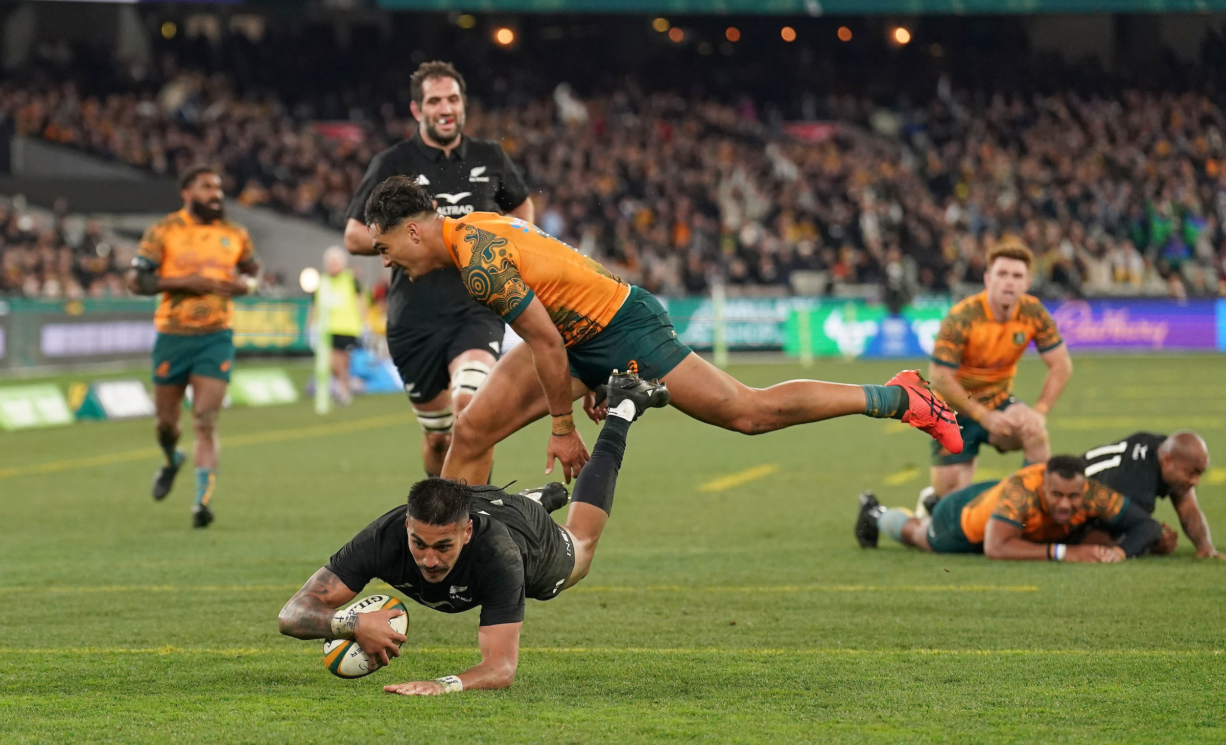 Rieko Ioane dives over for a late try for the All Blacks at the Melbourne Cricket Ground.