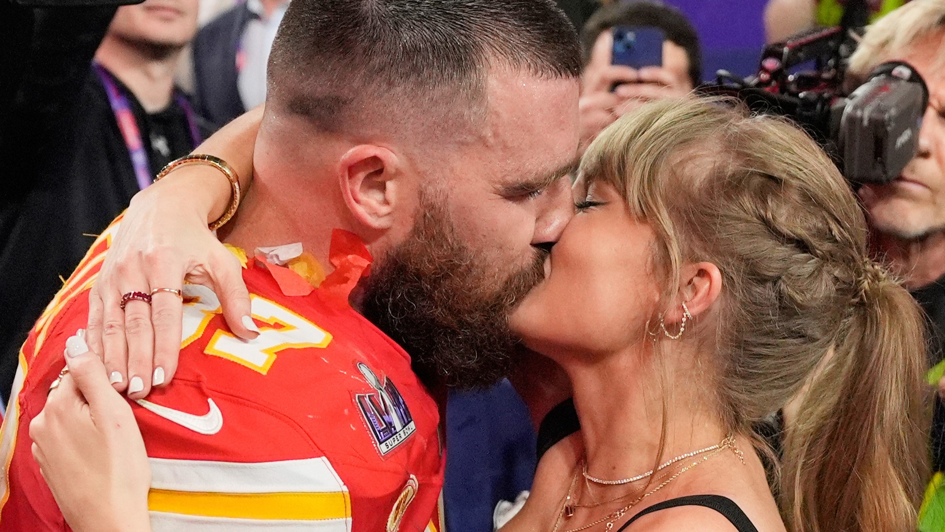 Kansas City Chiefs tight end Travis Kelce (87) and Taylor Swift kiss after the Chiefs defeated the San Francisco 49ers in the NFL Super Bowl 58 football game on Feb. 11, 2024, in Las Vegas.