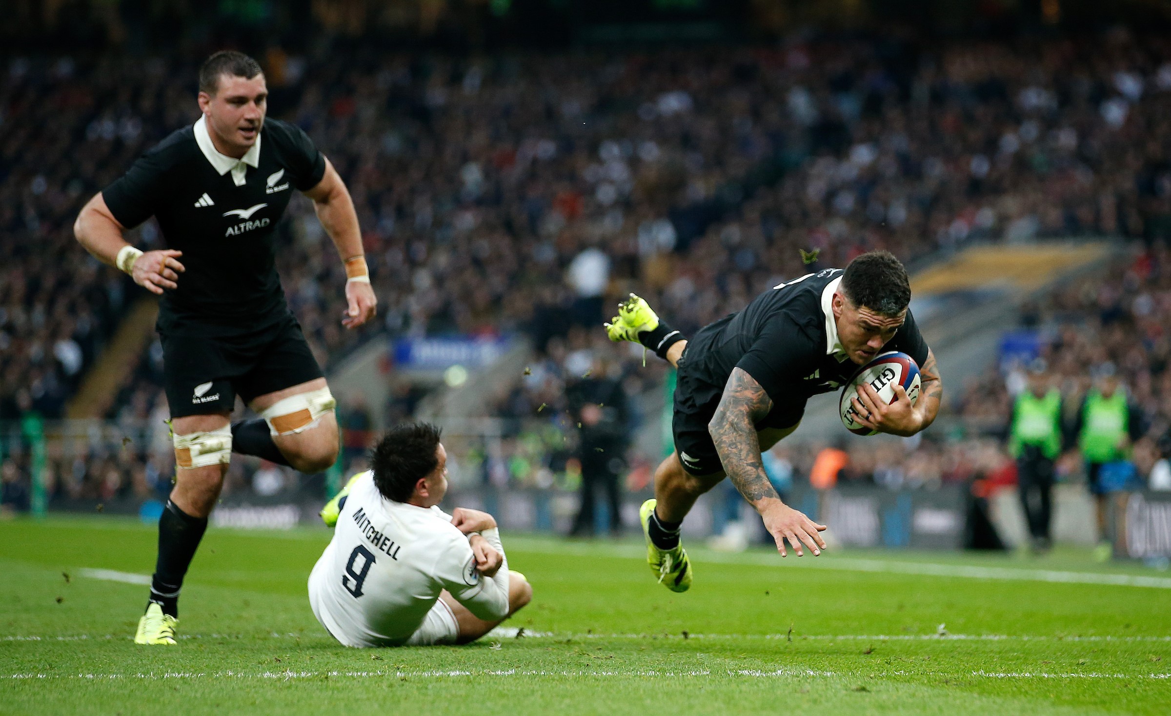Hooker Codie Taylor dives over for the All Blacks' second try at Twickenham.