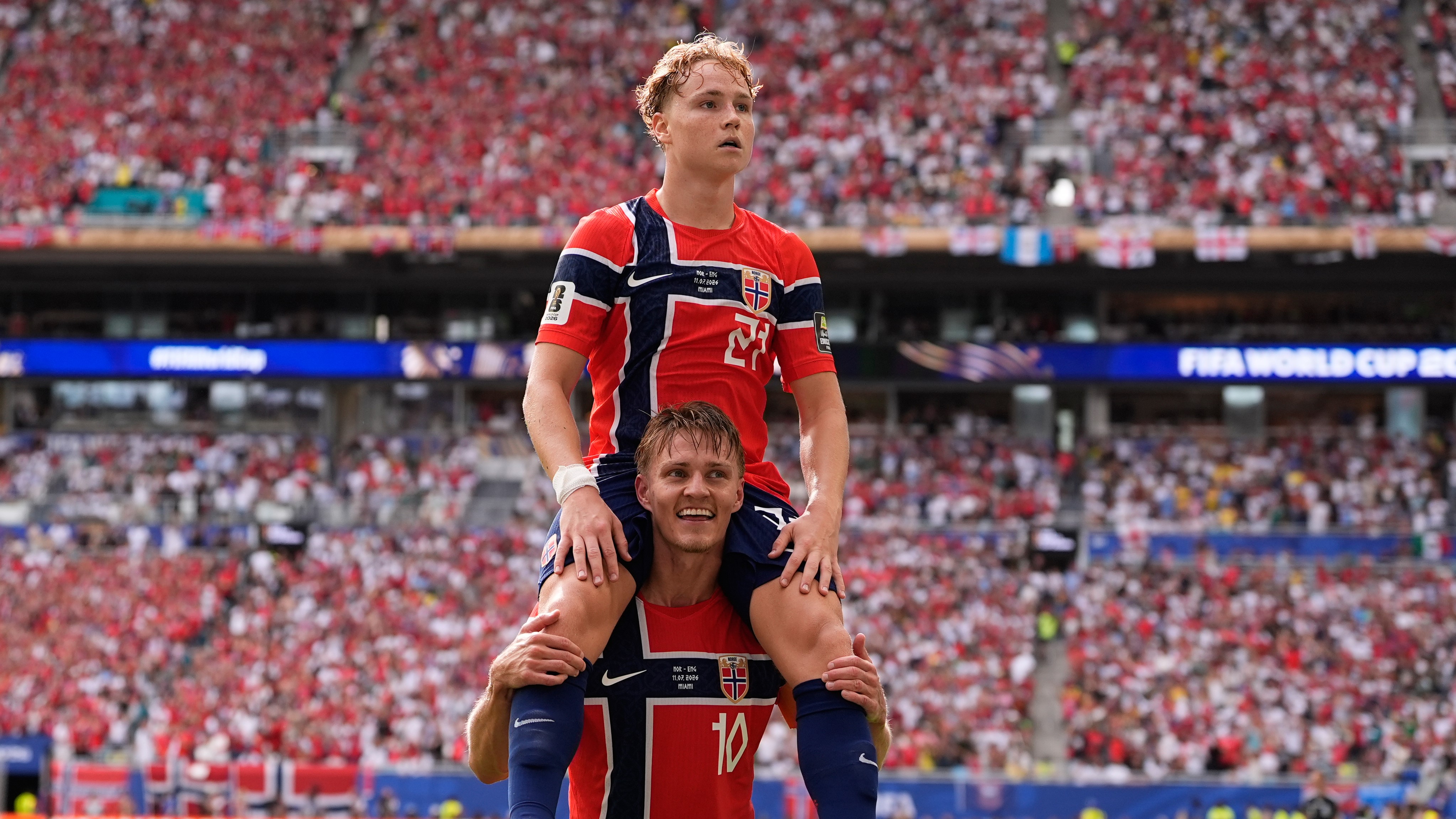 Andreas Schjelderup is lifted onto Martin Ødegaard's shoulders after he scored Norway's only goal.