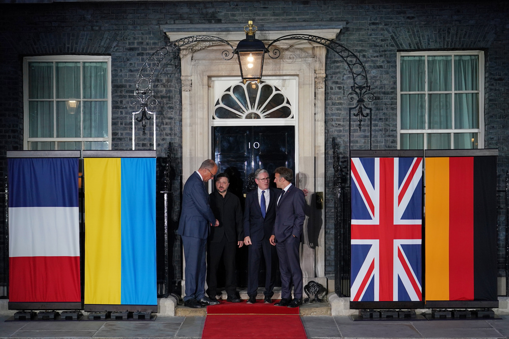 Britain's Prime Minister Keir Starmer, second from right, stands with France's President Emmanuel Macron, right, Ukraine's President Volodymyr Zelenskyy, second from left, and Germany's Chancellor Friedrich Merz, on the doorstep of 10 Downing Street after their meeting in, London, Sunday, June 7, 2026.