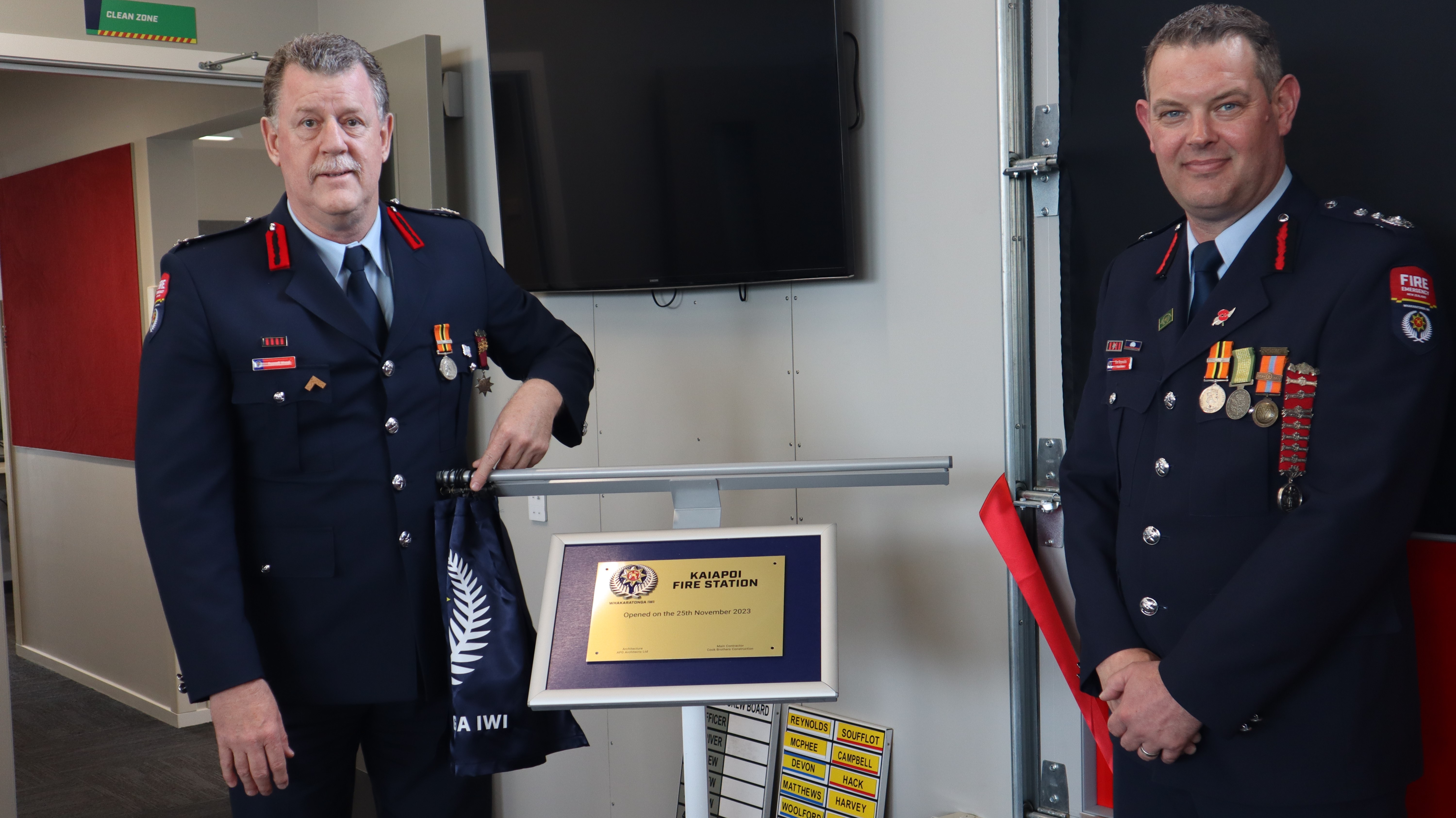 Fire and Emergency National Commander Russell Wood (left) and Kaiapoi Chief Fire Officer Tim Reynolds with the plaque