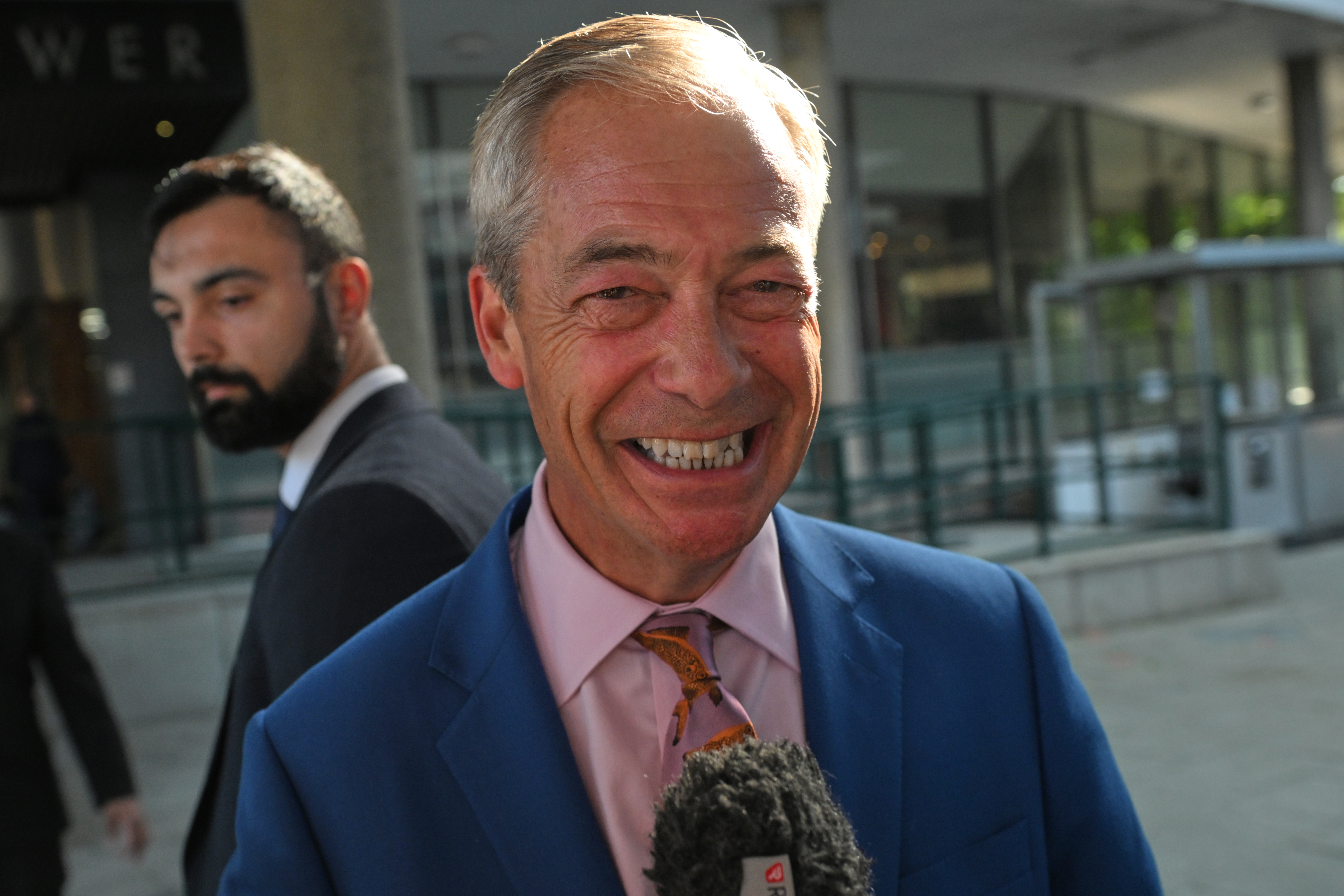 Britain's Reform UK leader Nigel Farage leaves Milbank Tower after he said he'll quit his Parliament seat and seek reelection in London.