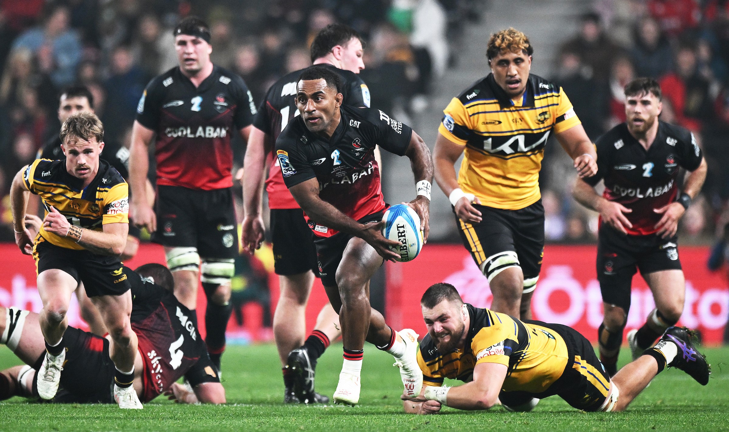 Sevu Reece, in his 100th game for the Crusaders, makes a break against the Hurricanes.